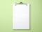 Top view blank paper and clip board. Desktop mock up, Flat lay of green working table background with office equipment