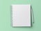 Top view blank paper Notebook and pencil. Desktop mock up, Flat lay of green working table background with office