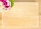 Top view of Blank wooden plate with flower on table top,Mock up