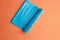 Top view of blue plastic garbage bags on an orange background