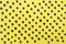 Top view of blueberries pattern on yellow background. Summer food concept