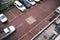 Top view of a blurred pick up truck passes by empty car parks