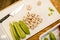 Top view of board with sliced champignons and green zucchini