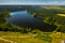 Top view of Bolta lake in the forest in the Braslav lakes National Park at dawn, the most beautiful places in Belarus.An island in