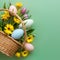 Top view border of Easter themed background with basket, eggs, flowers