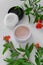 Top view of botanical face powder with blossom pomegranate branch