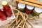 Top view of bottles of tomato sauce, preserved canned pickled food concept isolated in a rustic composition