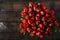 Top view bouquet of red tulips on dark wooden table