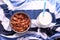 Top view of bowl of almond nuts and milk on table cloth