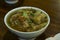 Top view of a bowl of soto seger or beef soup from Boyolali, Indonesia.