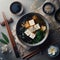 A top view of a bowl of steaming hot miso soup with tofu and seaweed. HD image