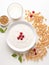 Top view of bowl of yogurt and cereals.
