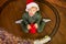 Top view of a boy in a red hat sitting on the floor, to whom a magic train brought a Christmas gift