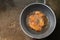 Top view, breaded pork In a pan, put vegetable oil.