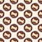 Top view of brown biscuit bones and kibble pieces for dog feed seamless repeat pattern on light beige background.