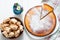 Top view: brown meringues and manna semolina pie on white wooden table