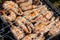 Top view of the browned steaks of red coho salmon fried on charcoal in a barbecue on a summer day in the country. Cooking a