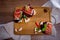 Top view on bruschetta sandwiches with jamon, tomatos and green sprouts  on wooden board.