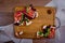 Top view on bruschetta sandwiches with jamon, tomatos and green sprouts  on wooden board.
