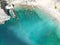 Top view of a building near a rocky cliff on the coast of Sesimbra in Portugal