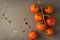 Top view of a bunch of natural cherry tomatoes on cement background with copy space