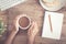 Top view of business hand on desk have coffee, toast, notebook blank  and pencil  on