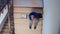 Top view of businessman sitting on stairs analysing documents