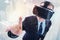 Top view of businessman in VR headset raising finger