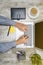 Top view of businessman working using laptop with coffee, potted plant, notebook, notes paper and business accessories