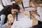 top view of businesswomen sleeping on table with boxes of noodles with chopsticks