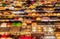 Top view of busy Asian street food at railway night market in Thailand with colorful stall and light at night time.