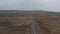 Top view car driving ring road exploring wild iceland countryside. High angle view panoramic landscape icelandic