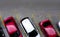 Top view of car parked at concrete car parking lot with yellow line of traffic sign on the street. Above view of car in a row at