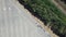 Top view car Parking lot, railroad, row of trees. Aerial view from Drone cars Moving on parking. Car traffic and Parking