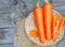 Top view carrots in a tray, bamboo basket basket on the table, delicious taste, contains vitamins that are beneficial to healt