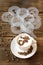 Top view of ceramic cup of hot cappuccino coffee latte with drawing picture of cafe sign with cinnamon or cocoa on milk