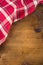 Top view of checkered kitchen towels on wooden table