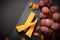 Top view of Cheese platter with hard cheese pieces, grapes, almonds on black slave stone board