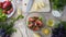 Top-view of chef hands adding salt into bowl with fresh salad, cooking show