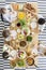 Top view on children eating healthy food at table during birthday party