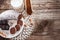 Top view on chocolate salami on plate and wooden scoop with coco