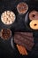 Top view of chocolate tablets, donuts, brown sugar with peanuts in chocolate and coffee beans