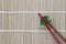 Top view chopsticks on bamboo mat