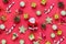 Top view Chrismas decoration and Santa Claus doll on red background.