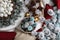 Top view christmas decorations centerpiece with garland and balls near a basket with colorful pine cones,  on a white