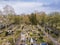 Top view of the city cemetery in Viernheim. Rows of graves. Gray trees.