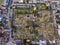 Top view of the city cemetery in Viernheim. Rows of graves. Gray trees.