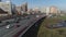 Top view of city road on background of multi-storey residential buildings. Scene. Traffic on city road in morning