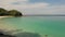 Top view of clear azure blue transparent sea with white sand