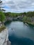Top view of the cliffs, grotto and boats floating in the turquoise waters of Marble Canyon in Ruskeala Mountain Park on a summer